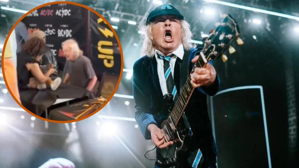 Angus Young autografa bebê durante evento do AC/DC em Toronto